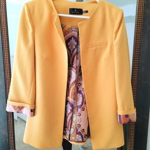 Mustard yellow blazer.